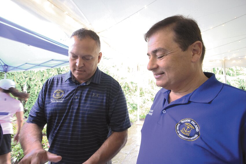 SCRAMBLING FOR ANIMALS: House Speaker K. Joseph Shekarchi (right) who initiated the golf scramble for the benefit of animal rescue organizations three years ago looks over plans with Rep. Tom Noret who headed the group that ran the golf and dinner event on Tuesday. (Warwick Beacon photos)