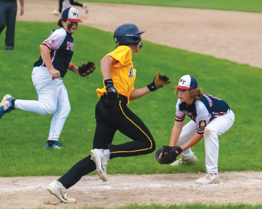 APPLY THE TAG: Tree Post&rsquo;s Kyle Rezendes tags out a runner at first base.