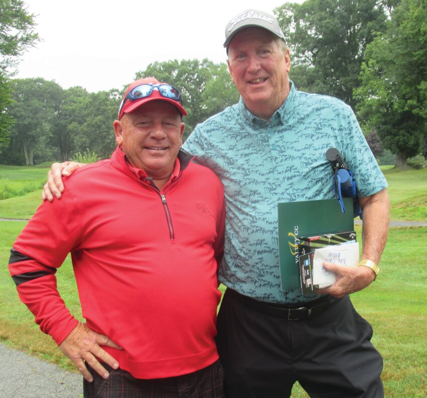 FAMILY FRIEND: John Graham (left), who has been a long-time friend of the Hopkins family, served as the official greeter to Cranston Mayor Ken Hopkins at last week&rsquo;s highly successful scholarship fund golf tourney. (Herald photos by Pete Fontaine)