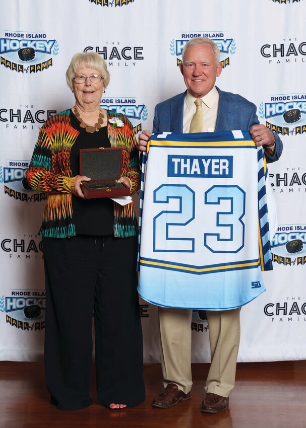 HALL OF FAMER: Paula Thayer Silvia and Joe Cavanagh accept the late Bill Thayer&rsquo;s RI Hockey Hall of Fame enshrinement jersey last weekend. (Photos courtesy of the RI Hockey HOF)