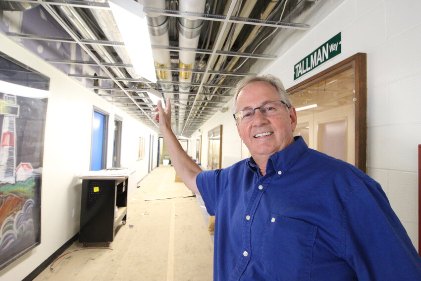 BUTTONING THINGS UP: On a tour Sunday of Warwick Neck School, contractor Glenn Alhborg points some of the work to be done in preparation to having the building accessible to clean up crews. (Warwick Beacon photos)