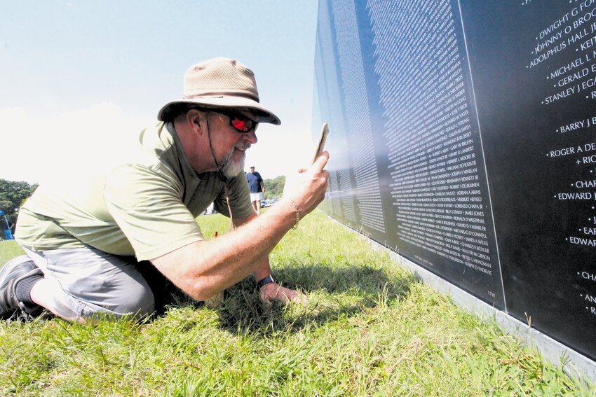 MAKING A CONNECTION:  Albert Pard of Burrillville and his family came to find the name of Henry R. Lambert on the wall. A cousin, Lambert was killed when the tank he was riding was hit by a hand grenade in October  1969. &ldquo;He was just a young kid,&rdquo; Pard said of Lambert who he remembers as being a fast runner, especially when chased by his (Pard&rsquo;s) dog. (Warwick Beacon photo)