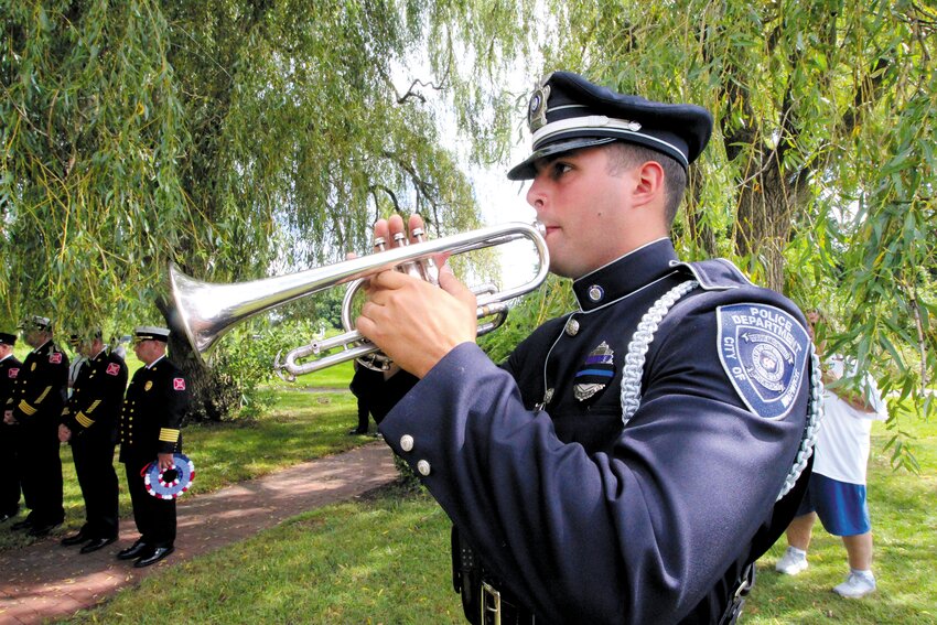 DAY IS DONE: Warwick police officer Oliver Pinheiro plays Taps to conclude the ceremony.