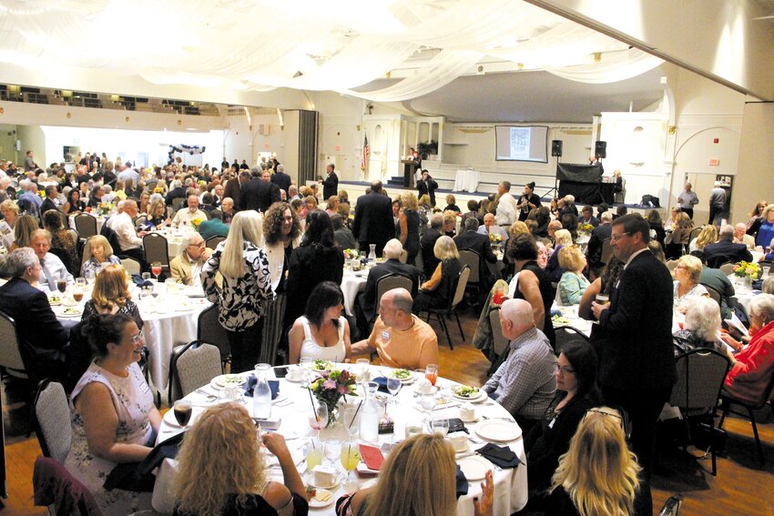 NOT A SINGLE EMPTY SEAT: Rhodes on the Pawtuxet was packed for the celebration. The formal ceremony concluded at 9:30 but with the band playing and what turned out to be a reunion of sorts between classes, teachers and clergy, the last of the guests didn&rsquo;t leave until midnight.