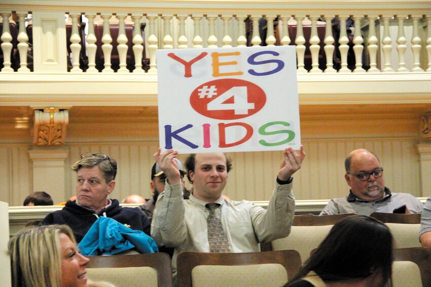 YOU KNOW WHERE HE STANDS: Jacob Madore displays were he stands on the issuance of $350 million in bond funds for new high schools at Monday&rsquo;s Council meeting. (Warwick Beacon photos)