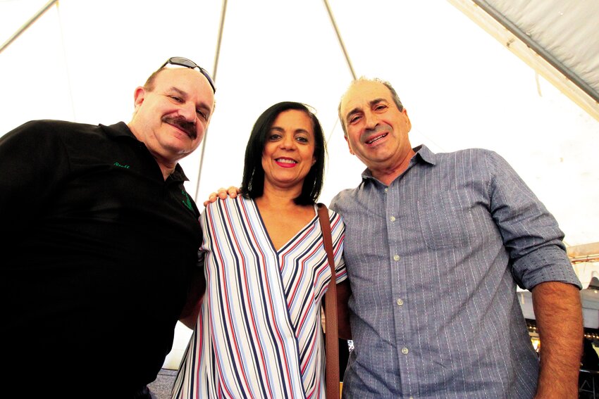 IT&rsquo;S ALL ABOUT FRIENDS: Joseph Checrallah Jr., at left, who Fr. Saab dubbed the church&rsquo;s historian, said the church acquired the former St. Ann Church in Cranston after a fire at the St. George Maronite Catholic Church in Pawtucket. He is joined by parishioners Antoinette and Roger Pereira.