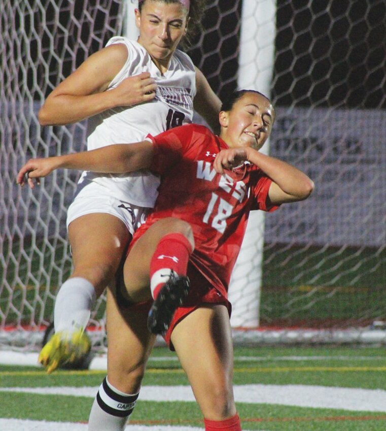 BATTLE FOR THE BALL: Adalina Menezes in a scrum for the ball.