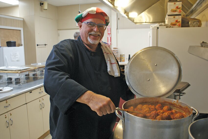 MIXING IT UP: &ldquo;Chef&rdquo; Joe Cantone mixes up a batch of pasta and Meatballs for the event. (Photos by Steve Popiel)