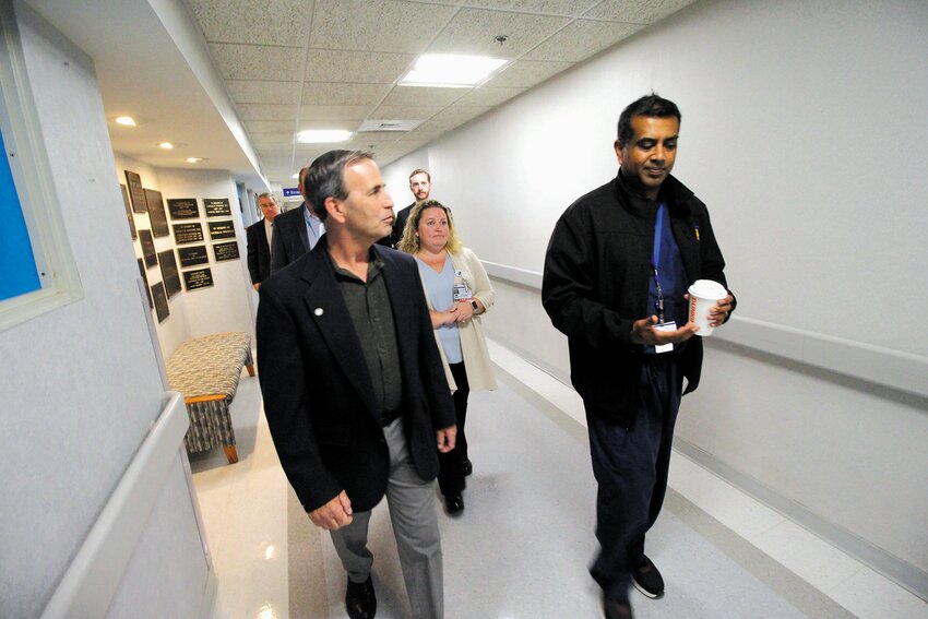 TOUR GUIDE: Paari Gopalakrishnan, MD, MBA, is president and chief operating officer of Kent Hospital led Mayor Frank Picozzi on a tour of the hospital Monday with members of the Kent team. Gopalakrishnan was in his scrubs after having spent several early morning hours in the emergency room &ndash; often the busiest time &ndash; to get a personal up front view of operations. (Warwick Beacon photo)