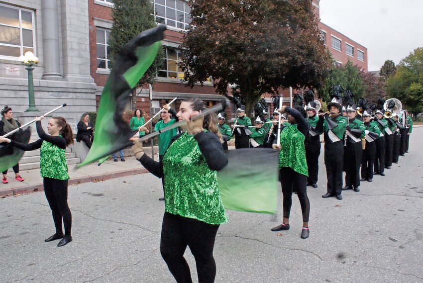 BIG BAND ENERGY: The CHSE Marching Band takes to the street to lead the way on a march to the football team&rsquo;s big game of the night. (Photo by Steve Popiel)