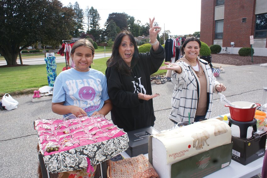 WHAT A SURPRISE: Prepared to sell the entire package of jewelry as one, Martinha Javid and her Daughter Bella Couto (left) discover name brand jewelry inside with volunteer and cancer survivor Jeannie D&rsquo;agostino (center).