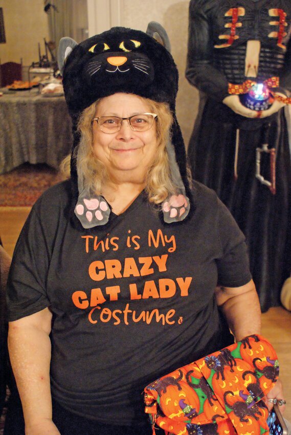 COSTUME OR NOT? Costumes were encouraged at the event but not mandated. Donna Neufeld rode the line perfectly with her Crazy Cat Lady costume that may also be her everyday outfit.