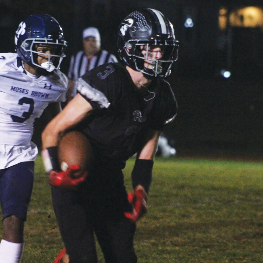 DROPPING BACK: Pilgrim quarterback Chace Roberts looks to pass.