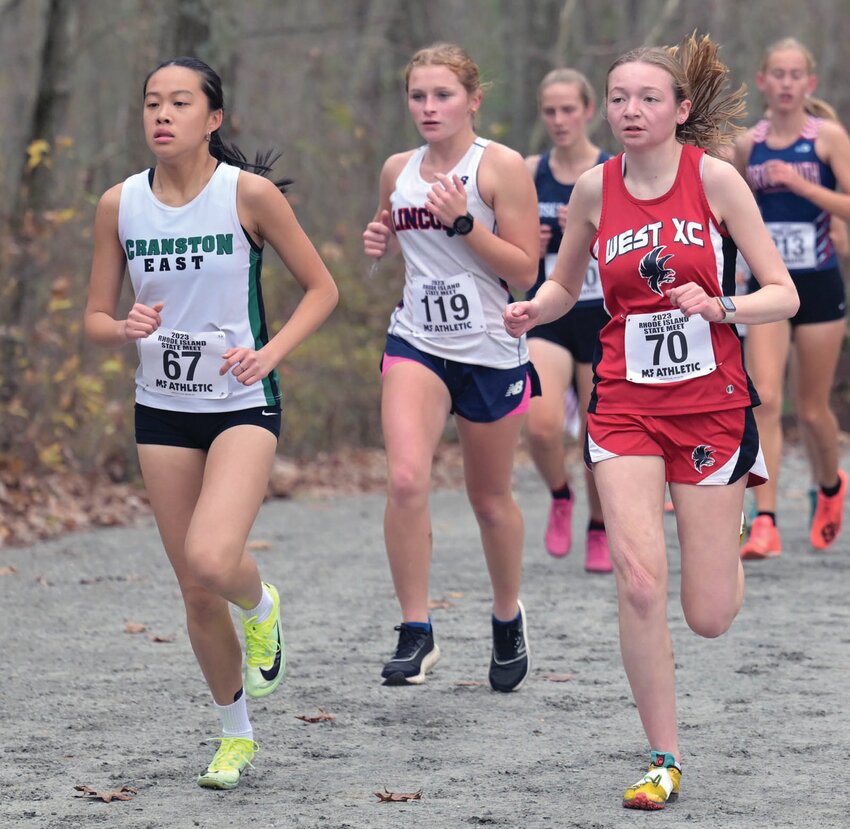 STATE MEET: East&rsquo;s Jessica Chin and West&rsquo;s Talia Petit compete at the cross country state championship last week. (Photos by Leo van Dijk/rhodyphoto.zenfolio.com)