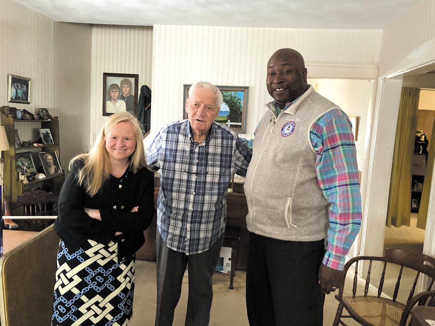 BRINGING IT IN: William Strand poses with Meals on Wheels Executive Director Meghan Grady (left) and R.I. Office of Veterans Services Director Kasim Yarn (right) following the meal delivery. (Warwick Beacon photo)