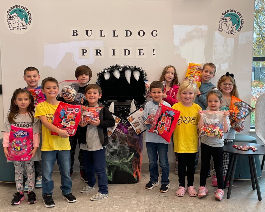 FRED SAYS I'M FULL: Students from Garden City School display the 149 pounds of candy they donated to Operation Made on Friday, November 10. Back row from left to right are: Lucas DeCarvalho, Rocco Forte, Maisey Phothisane, Lucas Scott, and Carmella Buonanno. Front row from left to right are: Angelica Parillo, Robert Pizzuti, Luca Forte, Harrison Mendonca, Chloe Shackleford, and Angelina Pizzuti.