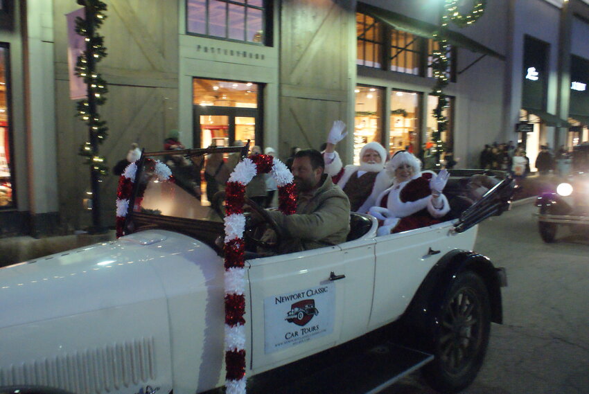 MORE HORSEPOWER: In lieu of a horse and carriage, this year Santa and Mrs Claus tooled around the center in a vintage Studebaker.