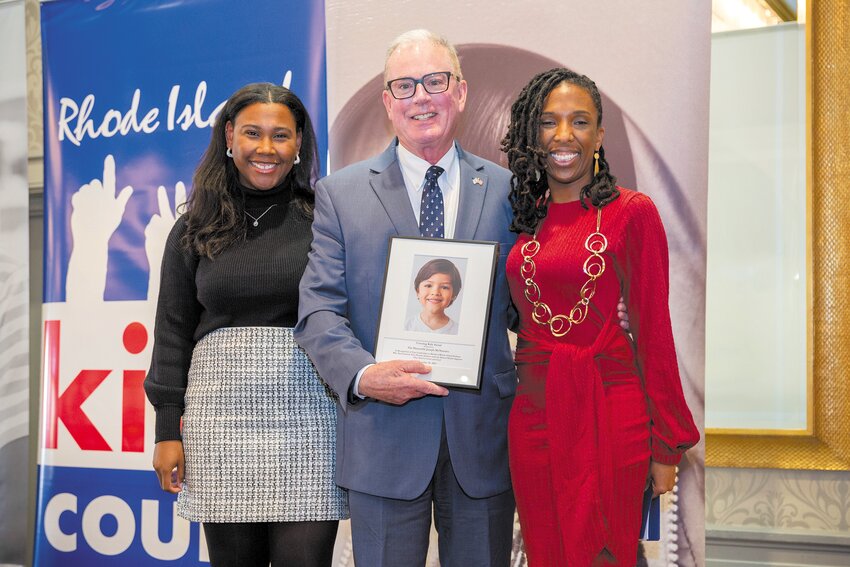 AWARD RECIPIENT: Rep. Joseph McNamara receives the Rhode Island Kids Count Covering Kids Award Monday at the Providence Marriott. At right is Kids Count Executive Director Paige Clausius-Parks. At left is Kids Count policy analyst Kaitlyn Rabb. (Submitted photo)