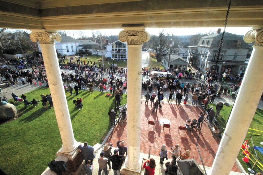 VIEW FROM ON HIGH: The parade crosses in front of City Hall as seen from the second floor of the building.