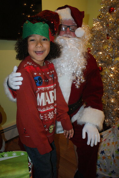 PHOTO-OP: Two-year old Daniel Reeves getting a photo in with Santa. (Photos by Steve Popiel)