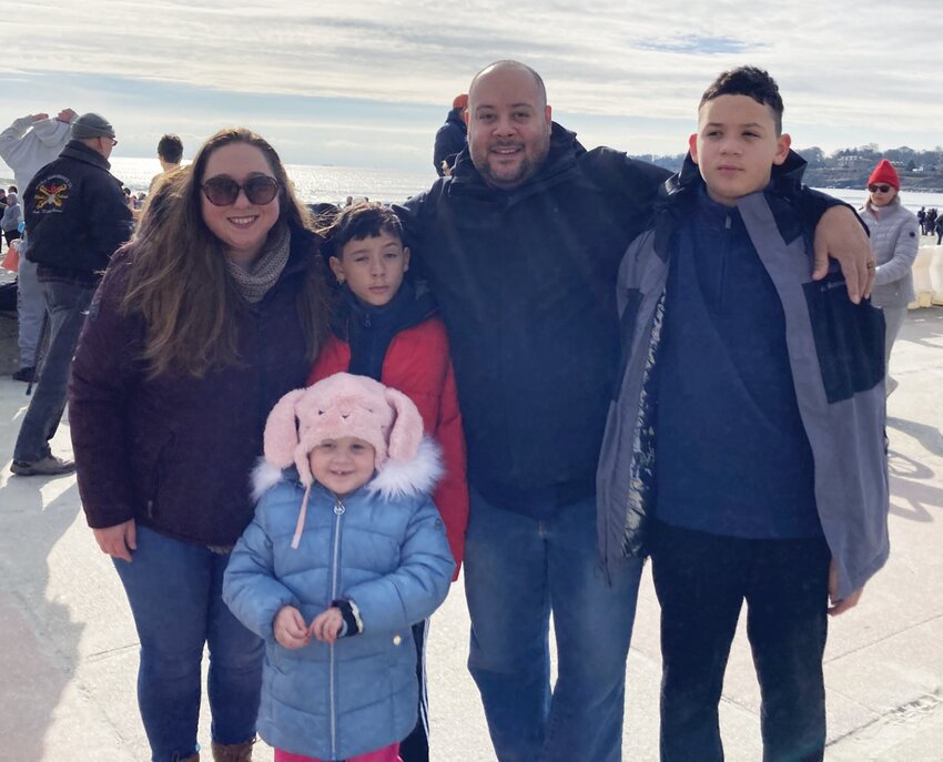 FAMILY BEACH DAY: Sofia&rsquo;s family poses in front of Easton&rsquo;s Beach as swimmers get ready to brave the waters behind them. (L-R- Christa Skipworth, Sofia Skipworth, Ethan Skipworth, Andrew Skipworth, Nathan Skipworth)