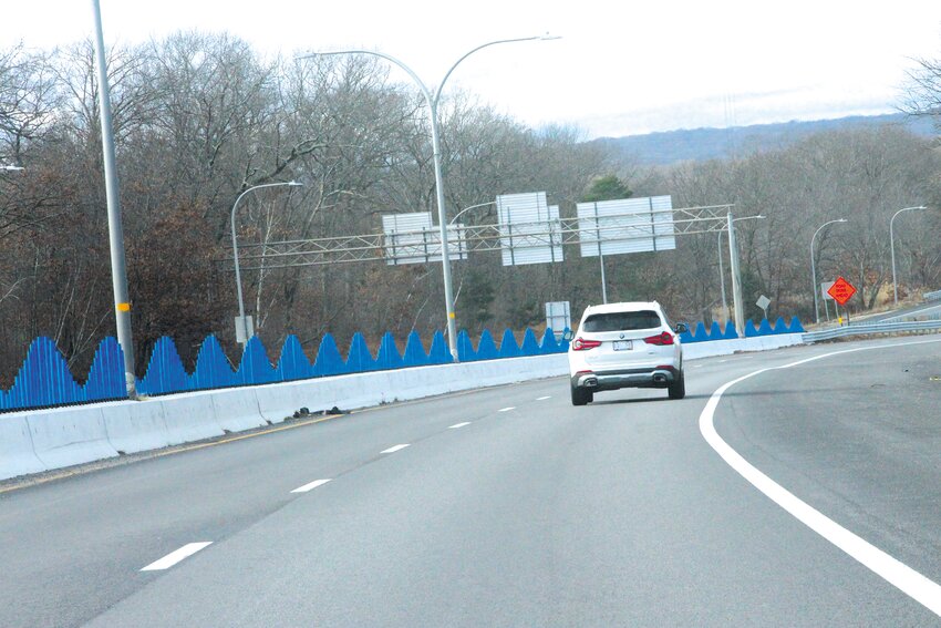 READY TO RIDE THE WAVES?  This addition to the Airport Connector divider greets those leaving the airport as they drive west. (Warwick Beacon photo)