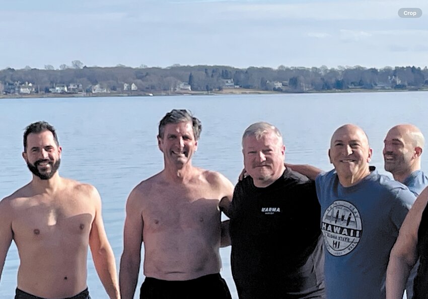 the chilly waters of Greenwich Bay on New Year&rsquo;s day to raise funds for the Buttonwoods Chapel Restoration Fund. More than $4,500 was raised by about 25 neighbors who took the plunge. (Photo courtesy of Michael Levesque)