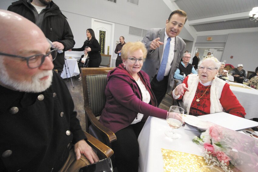 FUN WITH FAMILY: Speaker of the House Joe Shekarchi points at the camera while talking with Rita Gendron, 101. Also photographed is Rita&rsquo;s son, Norbert Morin, and his wife Kathleen. (Photos by John Howell)