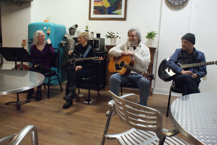 MUSICIANS IN THE ROUND: Host Jan Luby, with musicians Erin Ash Sullivan, John Egan, and John Devault. (Photo by Steve Popiel)