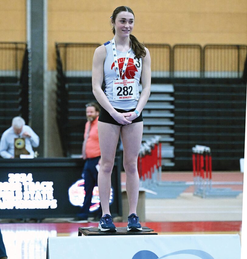 TAKING GOLD: Toll Gate&rsquo;s Alison Pankowicz after winning the state title in the 1,000 meter run. (Photos by Leo van Dijk/rhodyphoto.zenfolio.com)