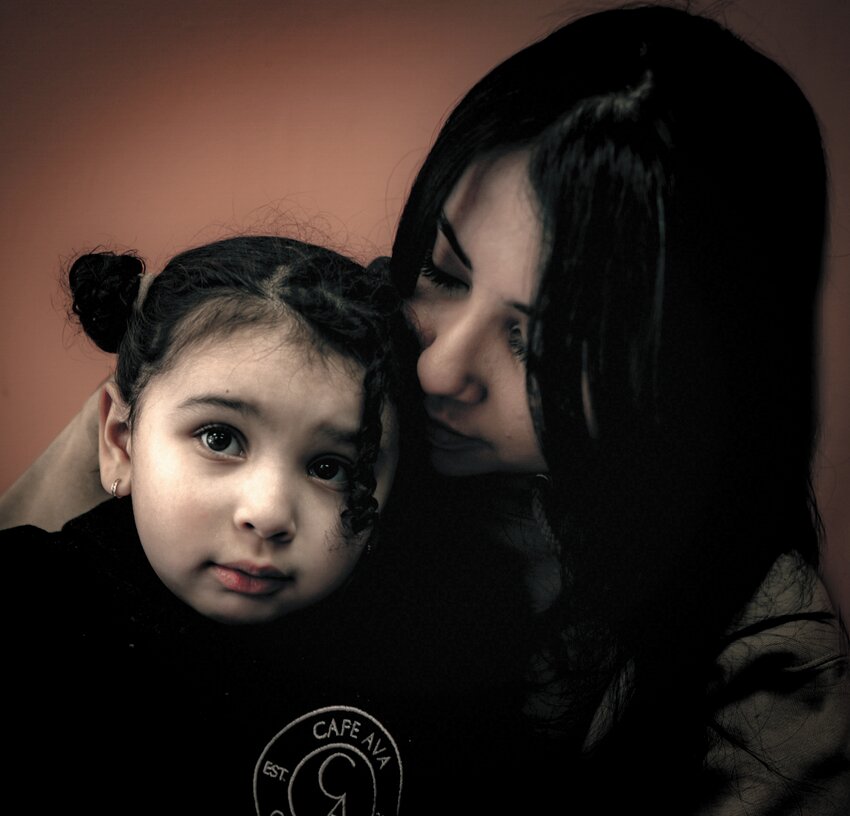 AVA: Andrea Moreno sits with her daughter Ava, after whom her caf&eacute; was named. (Photos by Tim McFate)