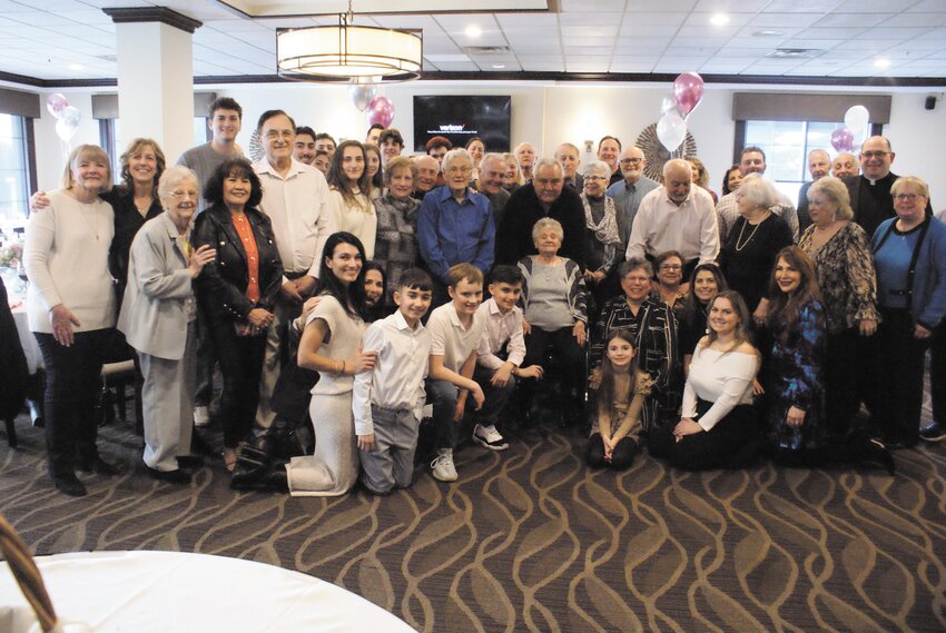 THE WHOLE PARTY: Everyone in attendance, including Notarianni&rsquo;s sizeable family, all stand together for a photo.