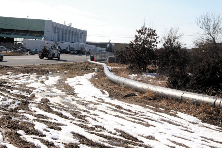 NOT FOR MUCH LONGER: Airport Road motorists have grown accustomed to the big pipes that serve as a bypass to the Cedar Swamp pressure line between the pump station off Cedar Swamp Road not far from Sandy Lane and a point off Airport Road where it is then carried to the waste water treatment plant. The relining of the in ground pipe that was seriously deteriorated is nearing completion, enabling removal of the bypass. (Warwick Beacon photos)