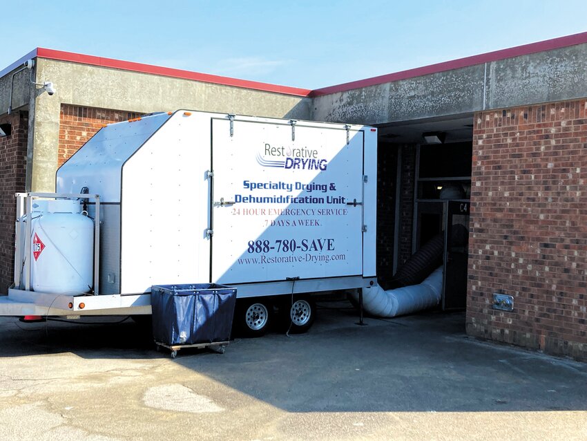 IN CLASS: The school department called in outside contractors  Monday in a push to dry out much of the building that was filled with steam following the freezing of a heater ventilator last weekend.  (Warwick Beacon photo)