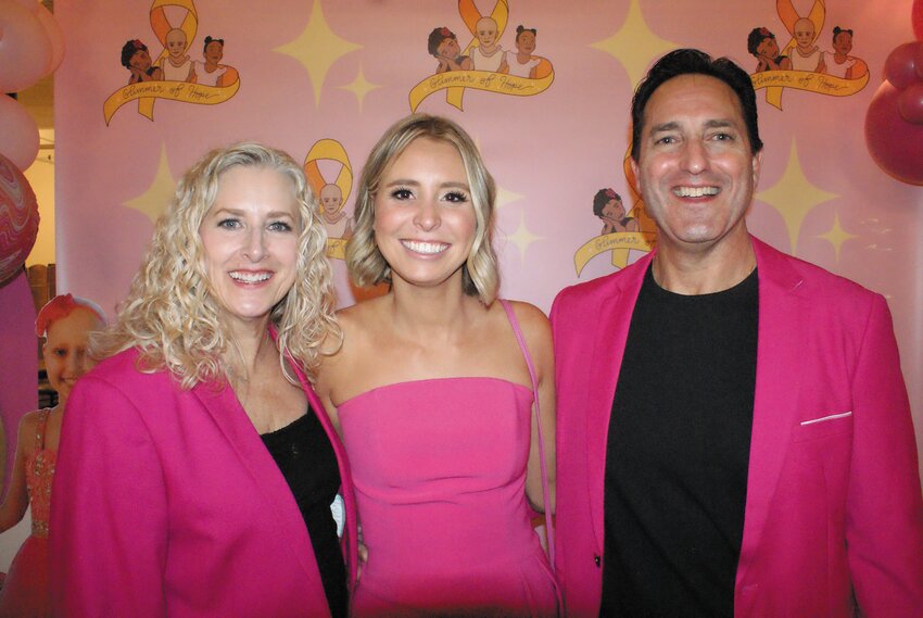 IN HONOR: Ali Hornung stands with Ella Catherine Integlia&rsquo;s parents Cathi and Chris Integlia. (Photo by Steve Popiel)