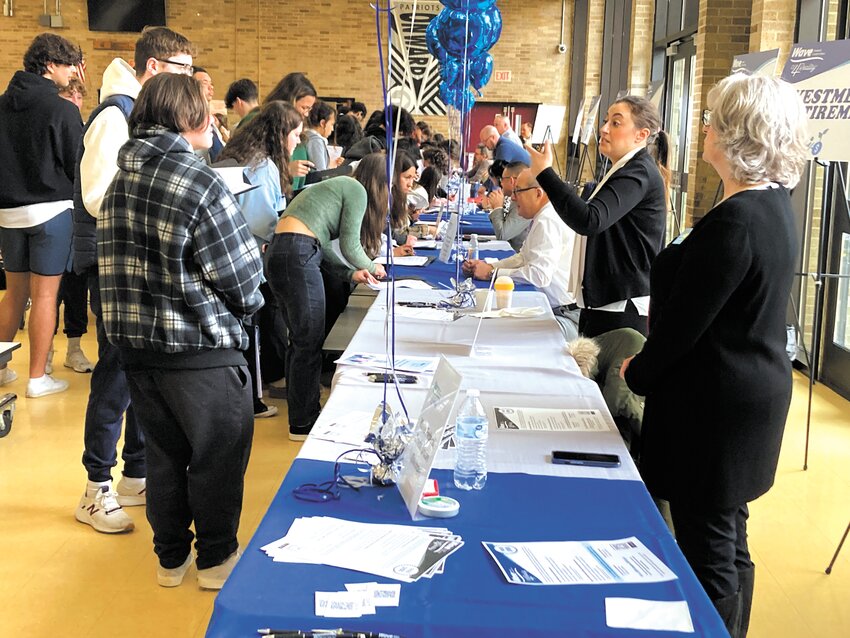 LEARNING ABOUT FINANCES: Students visited stations in the Pilgrim cafeteria manned  by local businesses where they projected the monthly cost of food, insurance, housing, utilities in developing individual budgets. (Warwick Beacon photos)