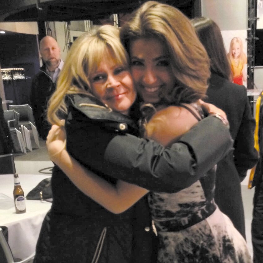 ALWAYS FRIENDS: Heather Santoro (right) embraces Tracy Sormanti, her former coach, at an event prior to Sormanti&rsquo;s passing.