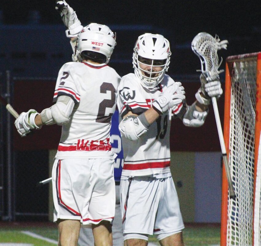 SENIOR NIGHT WIN: West&rsquo;s Jack Majcher and Justin Drohen after the team scored a goal on Monday night. (Photos by Alex Sponseller)