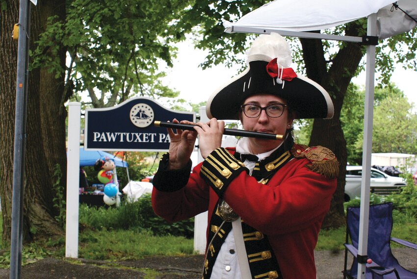 RIFE WITH FIFE: Pawtuxet Rangers Lt. Rachel Sczurek plays the fife at the Gaspee Days Arts and Crafts Fair. For more photos from the fair, turn to Page 3. (Cranston Herald photos by Steve Popiel)