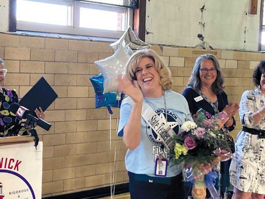 A PLEASANT SURPRISE: Milisa O&rsquo;Neil reacts after Angelica Infante-Green announces her as the 2024 Rhode Island Teacher of the Year.