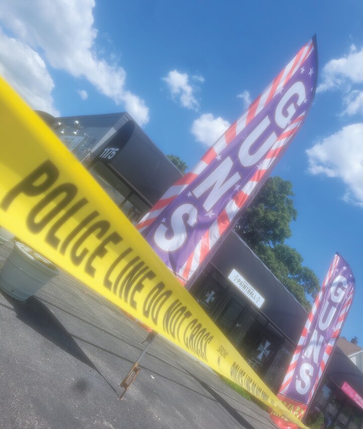 GUNS STOLEN: Warwick Police strung up tape outside RI Guns, at 1175 Post Road, following last week&rsquo;s break in. The broken entrance was covered in plywood. (Warwick Beacon photos by Rory Schuler)