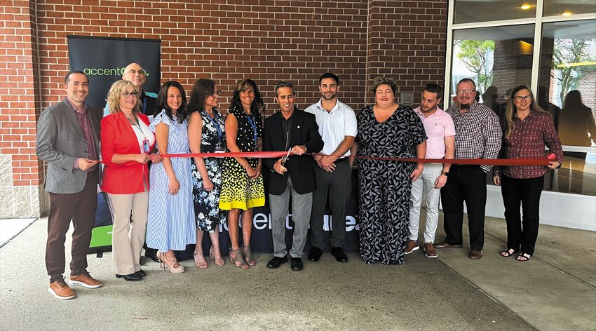 READY FOR CARE: Mayor Frank Picozzi cuts the ribbon officially opening AccentCare&rsquo;s new office at 300 Centerville Road. (Photo by Holly Titsworth)