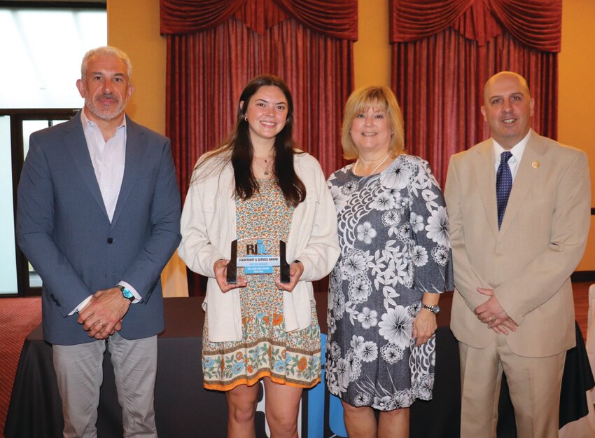 AWARD WINNER: Toll Gate&rsquo;s Adeline Areson (left) accepts her RIIL Distinguished Achievement Award. (Photo courtesy RIIL)