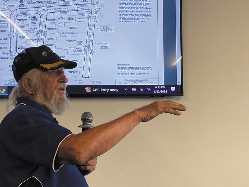 KEEP IT A PARK Richard Langseth addresses the Planning Board on June 12. He suggested that the RIAC property cleared of houses near the airport be kept accessible as a neighborhood park.