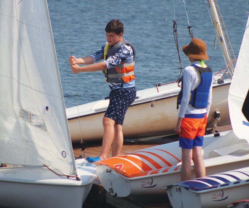 LEARNING THE ROPES: Youth sailors get ready to hit the water. (Photos by Alex Sponseller)