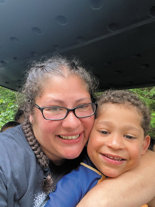 BEING UNDERSTOOD: &ldquo;We have people who understand us,&rdquo; Marcella Almeida says of the Trudeau Center as she cradles her son, Carter. Carter and his twin siblings, Nathan and Natalia, have been diagnosed with Fragile X syndrome, a genetic condition that impacts development, particularly behavior and the ability to learn. (Photo courtesy of Marcella Almeida)