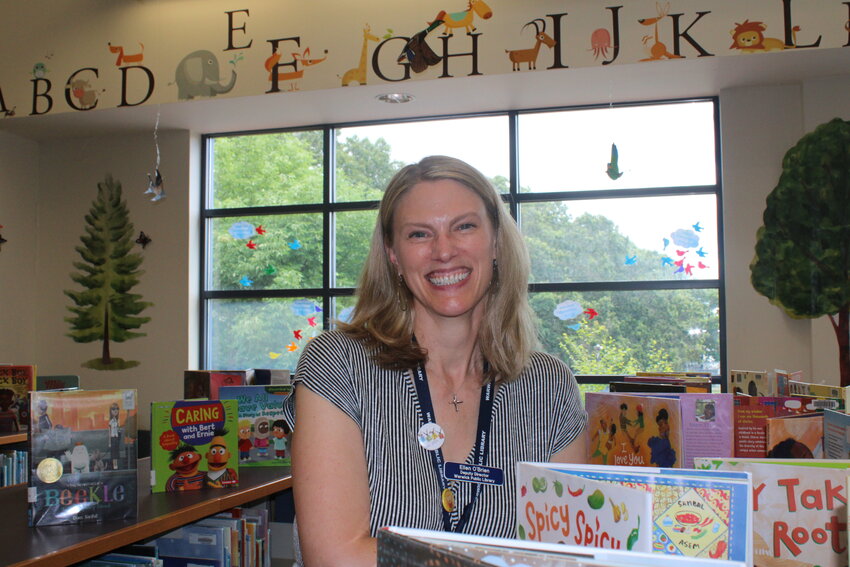 WITH THE KIDS: O&rsquo;Brien amongst the various picture books in the children&rsquo;s library, where she says she found her passion for public librarianship.