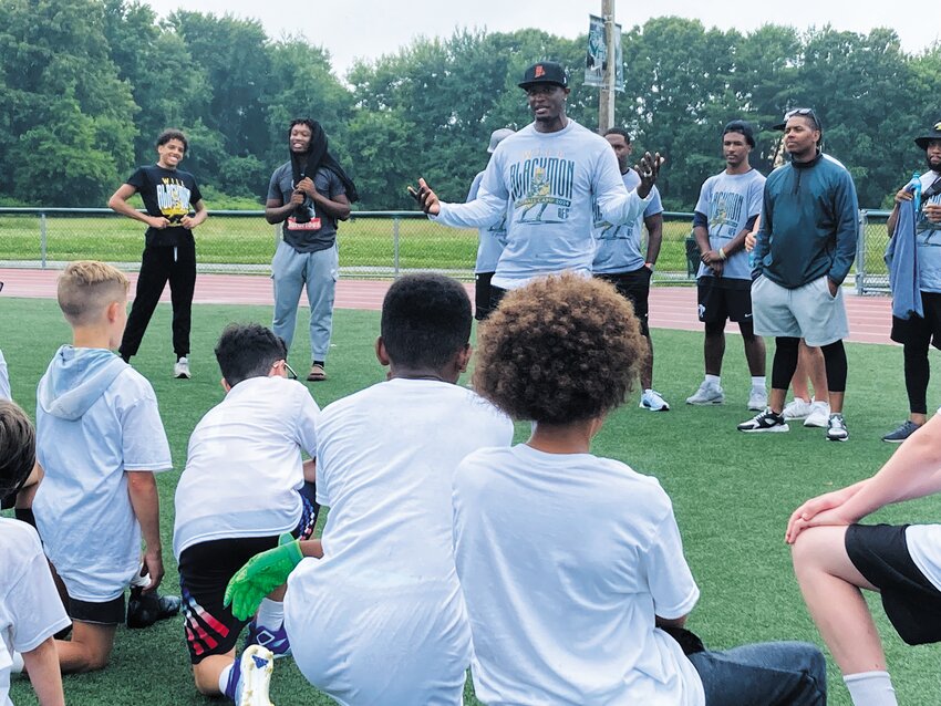 A WORD WITH COACH: Blackmon talks to campers at the beginning of the afternoon session about the day&rsquo;s activities. (Herald photo)