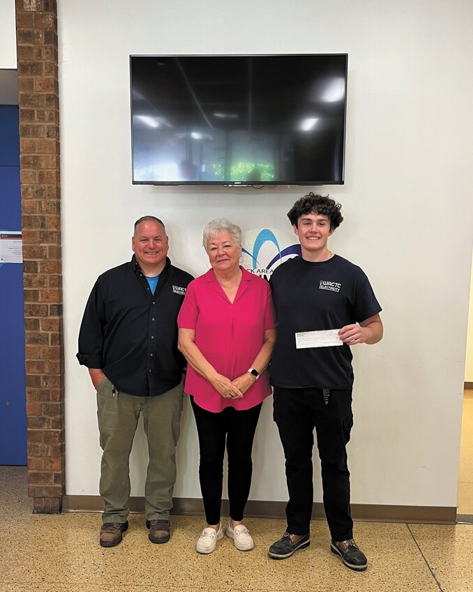 FAVORITE TEACHER: Kathy Newman and Devin Manzo smile for a photo with Manzo&rsquo;s teacher John Valletta, who instructs in the electrical technology program at the Career and Tech Center (Photo courtesy Warwick Area Career and Technical Center).