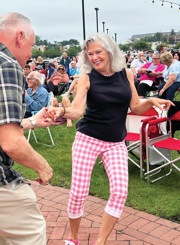 SERIES LAUNCH: The lawn around the gazebo at the Garden City Shopping Center in Cranston was crowded with spectators last Wednesday as people gathered to enjoy the first show of a four-week free summer concert series. (Cranston Herald photos by Barbara Polichetti)